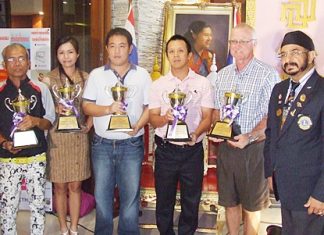 The flight winners of the 20th Sirindhorn’s Cup Golf Tournament pose for a photo with Lions Club President-elect of 2011-2012, Montri Sachdev (right).